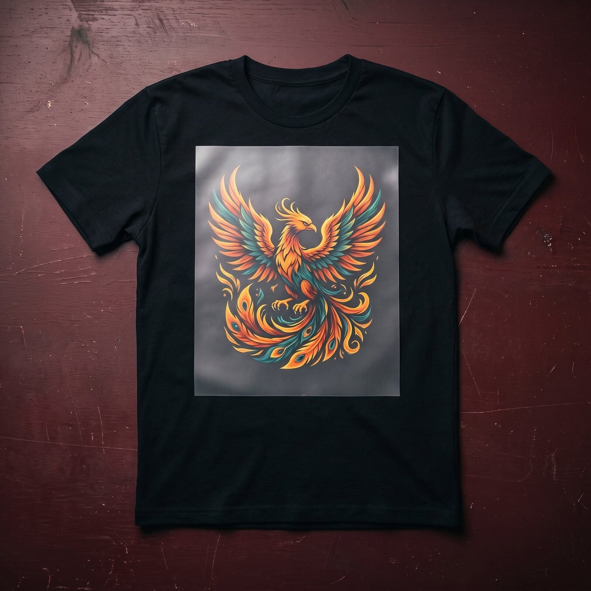 Phoenix DTF transfer on a black t-shirt before the film is peeled